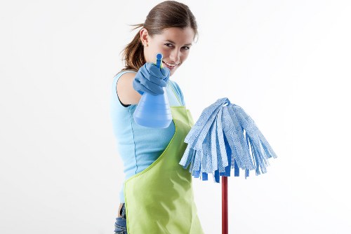 Professional house clearance team handling furniture removal in an NW1 property