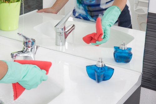 Cleaner working in a typical NW1 apartment with access and space considerations